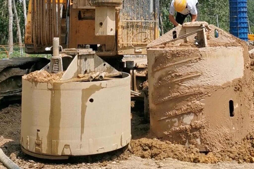 drilling bucket working in clay construction site